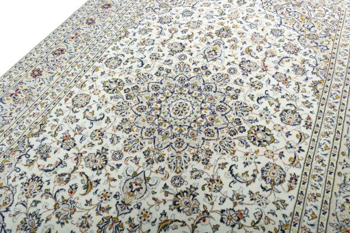 Backside of handmade 2000s Kashan rug showing knot structure and weave density