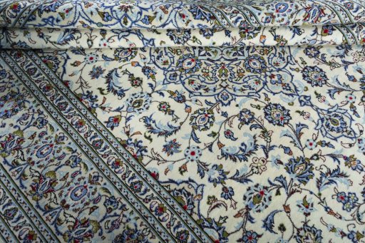 Close-up detail of 2000s Kashan rug from Iran / Persia showing Wool weave