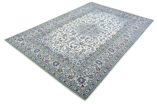Corner detail of 2000s Kashan rug showing border pattern and Wool pile