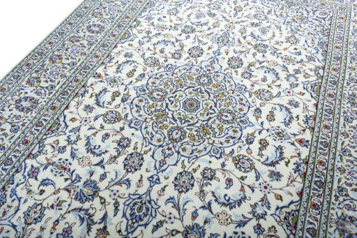 Backside of handmade 2000s Kashan rug showing knot structure and weave density