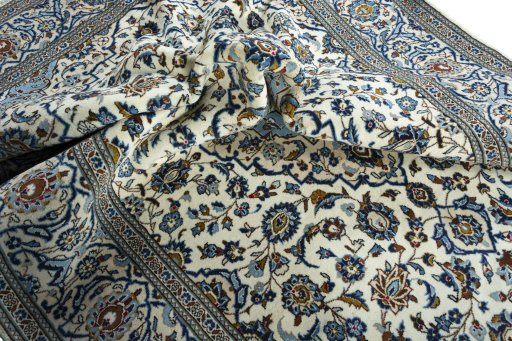Surface texture of 2000s Kashan rug with natural Wool and intricate pattern