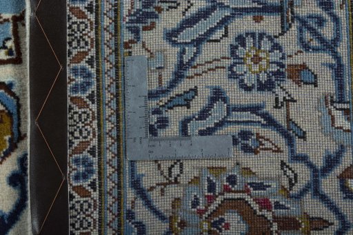 Backside of handmade 2000s Kashan rug showing knot structure and weave density
