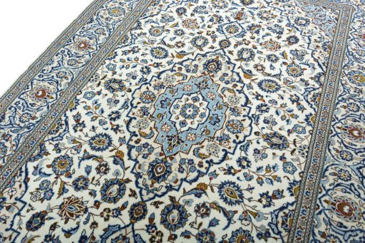 Backside of handmade 2000s Kashan rug showing knot structure and weave density
