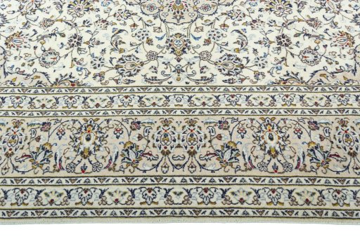 Corner detail of 2000s Kashan rug showing border pattern and Wool pile