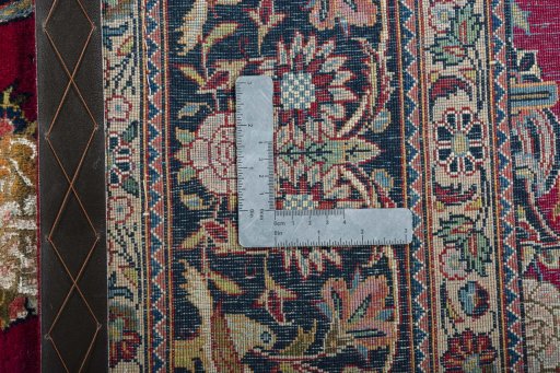 Backside of handmade 1930s Kashan rug showing knot structure and weave density