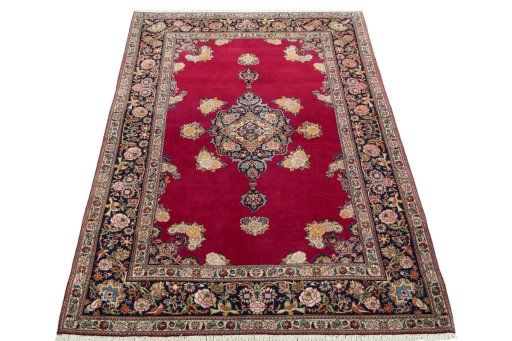 Surface texture of 1930s Kashan rug with natural Cork and intricate pattern