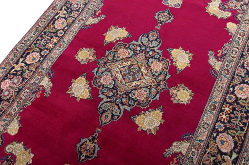 Backside of handmade 1930s Kashan rug showing knot structure and weave density