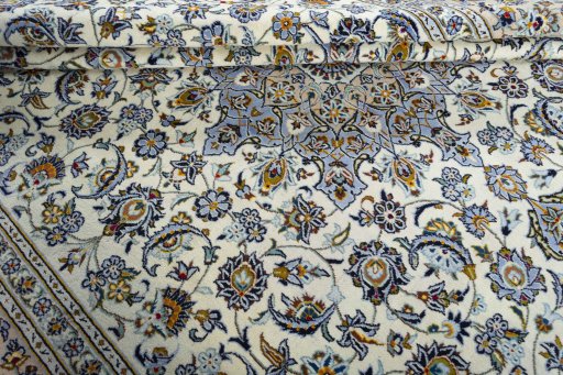 Close-up detail of 2000s Kashan rug from Iran / Persia showing Wool weave