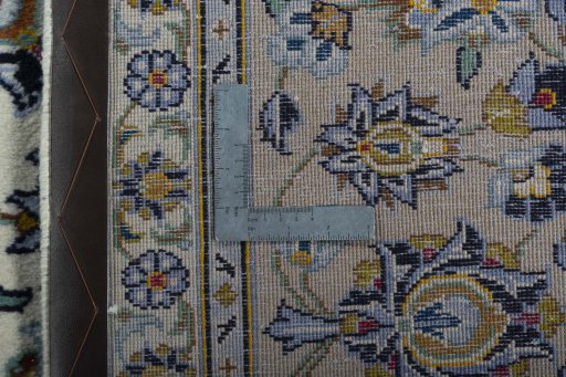Backside of handmade 2000s Kashan rug showing knot structure and weave density