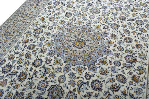 Backside of handmade 2000s Kashan rug showing knot structure and weave density