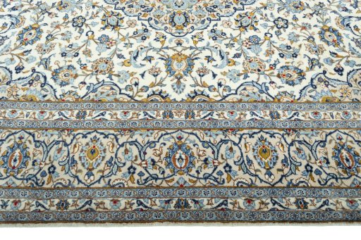Corner detail of 2000s Kashan rug showing border pattern and Wool pile