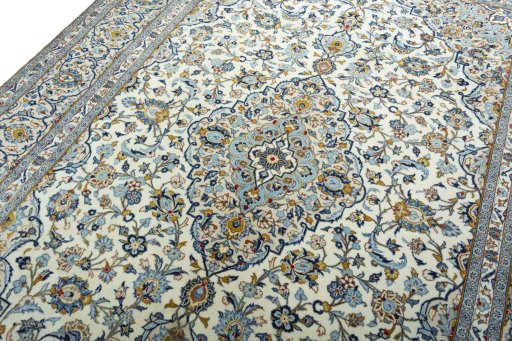 Backside of handmade 2000s Kashan rug showing knot structure and weave density