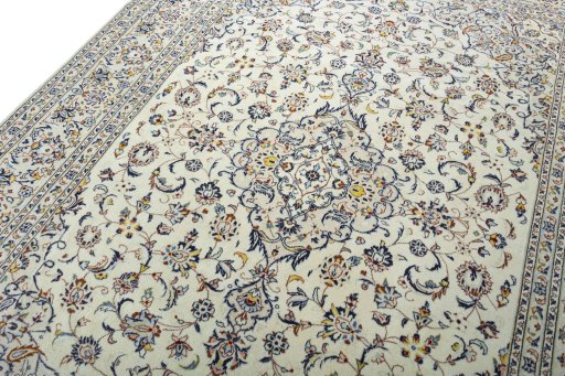 Backside of handmade 2000s Kashan rug showing knot structure and weave density