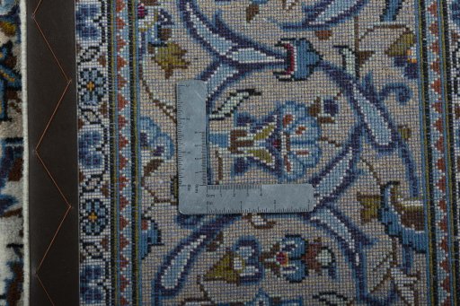Backside of handmade 2000s Kashan rug showing knot structure and weave density