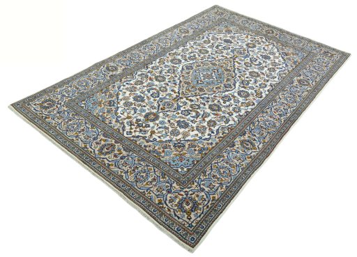 Corner detail of 2000s Kashan rug showing border pattern and Wool pile