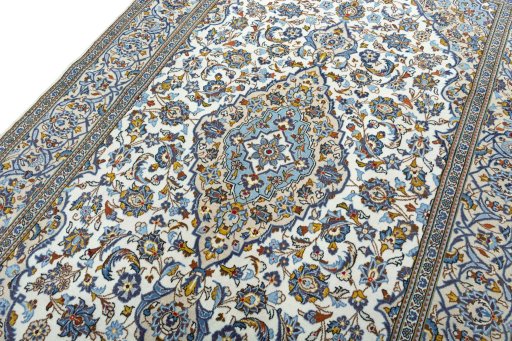 Backside of handmade 2000s Kashan rug showing knot structure and weave density