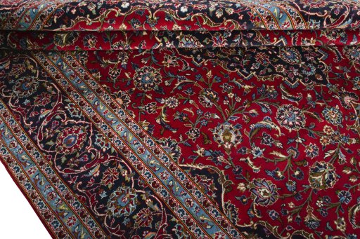 Close-up detail of 2000s Kashan rug from Iran / Persia showing Wool weave