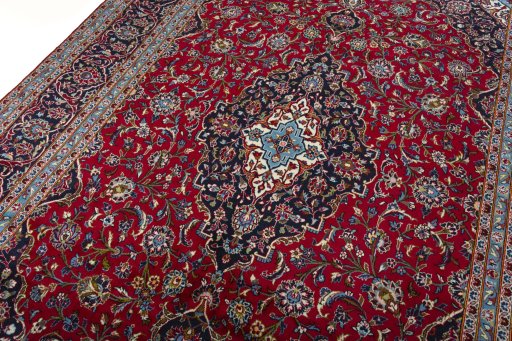 Backside of handmade 2000s Kashan rug showing knot structure and weave density