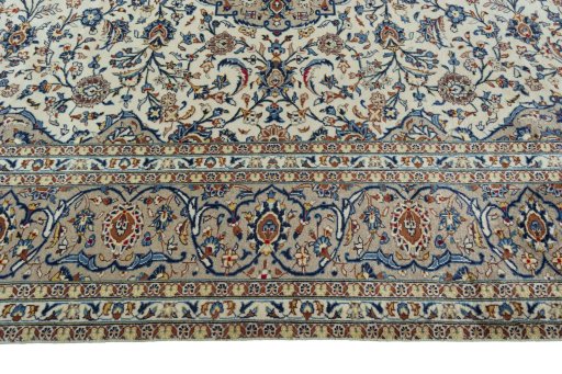 Corner detail of 2000s Kashan rug showing border pattern and Wool pile