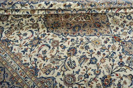 Close-up detail of 2000s Kashan rug from Iran / Persia showing Wool weave