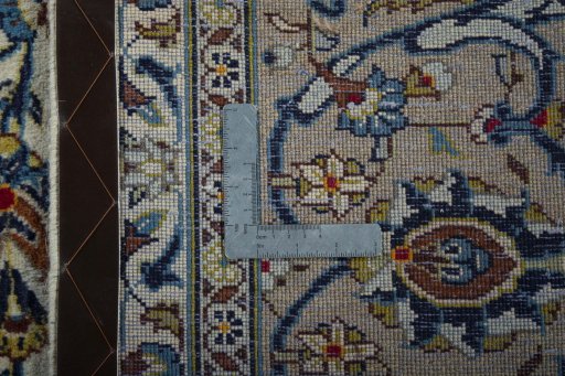 Backside of handmade 2000s Kashan rug showing knot structure and weave density