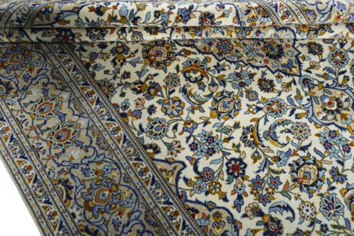 Close-up detail of 2000s Kashan rug from Iran / Persia showing Wool weave