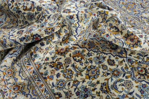 Surface texture of 2000s Kashan rug with natural Wool and intricate pattern