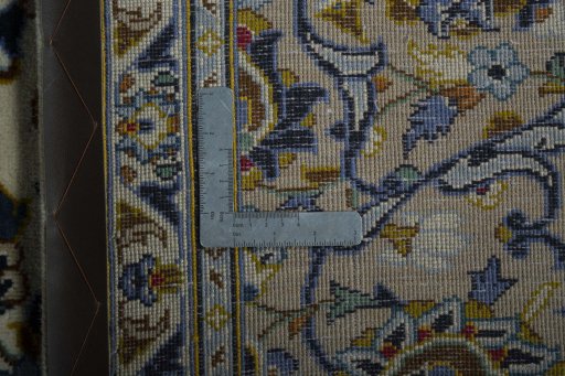 Backside of handmade 2000s Kashan rug showing knot structure and weave density