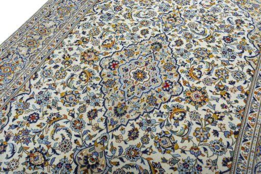 Backside of handmade 2000s Kashan rug showing knot structure and weave density