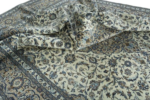 Surface texture of 2000s Kashan rug with natural Wool and intricate pattern