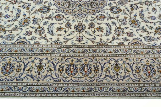 Corner detail of 2000s Kashan rug showing border pattern and Wool pile