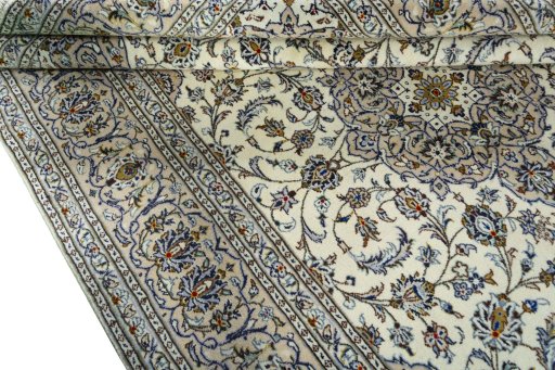 Close-up detail of 2000s Kashan rug from Iran / Persia showing Wool weave