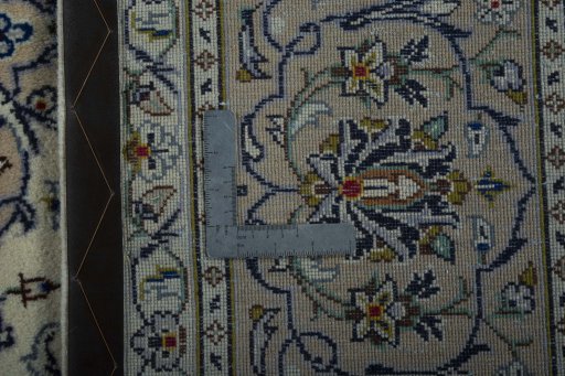 Backside of handmade 2000s Kashan rug showing knot structure and weave density
