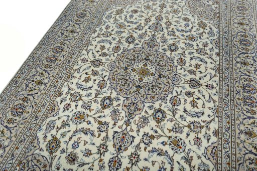 Backside of handmade 2000s Kashan rug showing knot structure and weave density