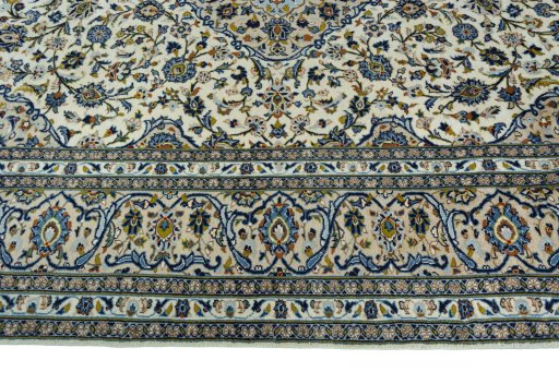 Corner detail of 2000s Kashan rug showing border pattern and Wool pile
