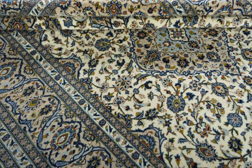Close-up detail of 2000s Kashan rug from Iran / Persia showing Wool weave