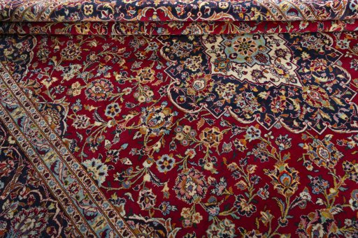 Close-up detail of 2000s Kashan rug from Iran / Persia showing Wool weave