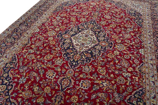 Backside of handmade 2000s Kashan rug showing knot structure and weave density