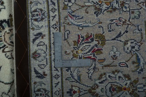 Backside of handmade 2000s Kashan rug showing knot structure and weave density