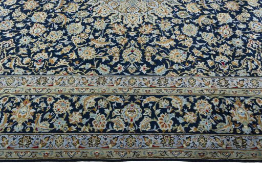 Corner detail of 1970s Kashan rug showing border pattern and Wool pile