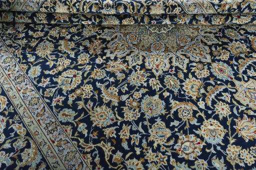 Close-up detail of 1970s Kashan rug from Iran / Persia showing Wool weave