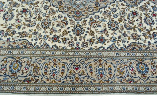Corner detail of 2000s Kashan rug showing border pattern and Wool pile