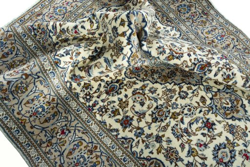 Surface texture of 2000s Kashan rug with natural Wool and intricate pattern