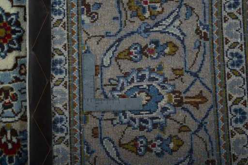 Backside of handmade 2000s Kashan rug showing knot structure and weave density