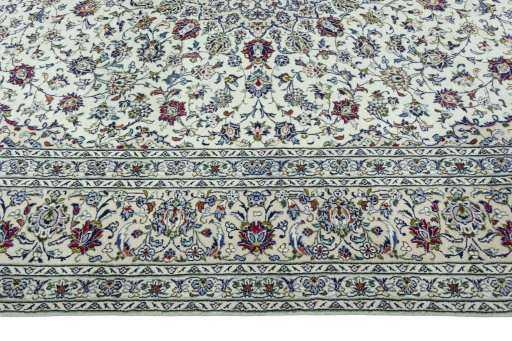 Corner detail of 2000s Kashan rug showing border pattern and Wool pile