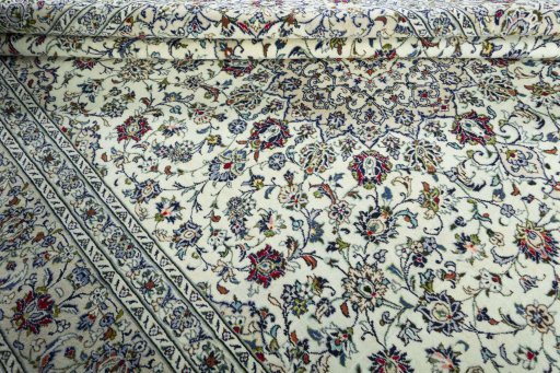 Close-up detail of 2000s Kashan rug from Iran / Persia showing Wool weave