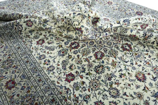 Surface texture of 2000s Kashan rug with natural Wool and intricate pattern