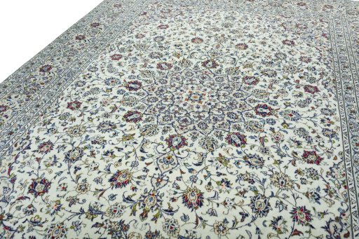 Backside of handmade 2000s Kashan rug showing knot structure and weave density