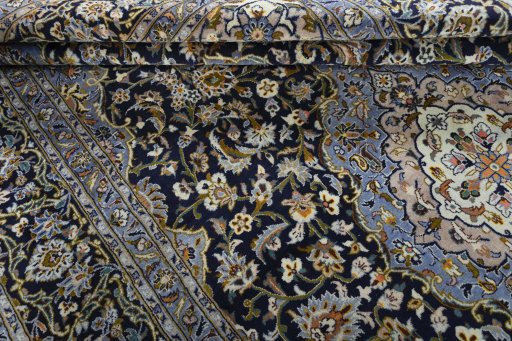 Close-up detail of 2000s Kashan rug from Iran / Persia showing Wool weave