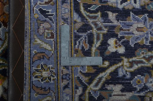 Backside of handmade 2000s Kashan rug showing knot structure and weave density